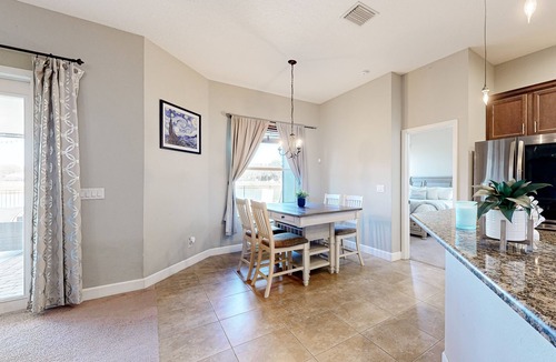 Plant City House | Modernly updated open home with lake view, screened-in patio, grill, AC, & W/D