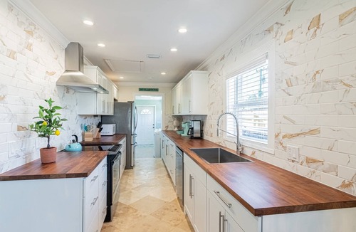 Naples Park House | Naples Park Home: w/private screened lanai, heated salt water pool/spa, poolside cabana w/TV