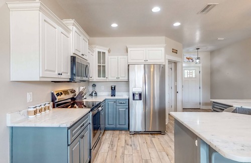 Crestview House | Nautical-themed retreat with a saltwater pool, fire table, full kitchen, and AC