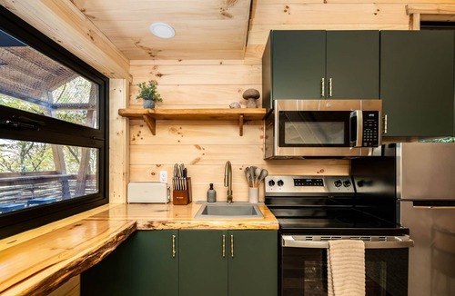 Sugarfork Cabin | Nest-Shaped Cocoon Treehouse on 4 Trees - The Marsu