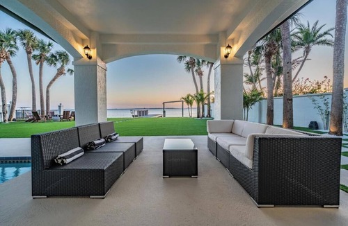 Palm Harbor House | NEW Waterfront 6 bedroom home with large pool and luxurious outdoor living area!
