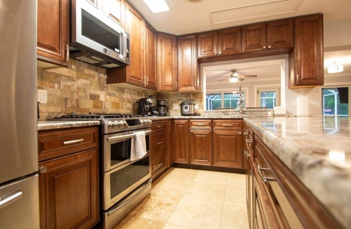 Fort Myers House | NEW! Waterfront Heated Pool, Kayaks, Fishing Pier.