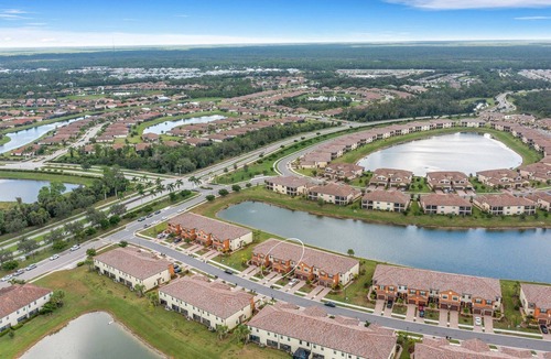 Gran Paradiso House | Newer 2022 Immaculate 4/2.5 Townhome Lake View in Resort Style Community