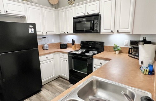 West Kissimmee Condo | Oakwater Resort, Two Miles to Disney, Lake View, Relax in our Hot Tub and Pool!