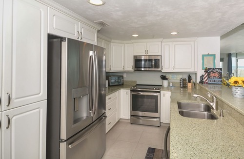 Bethune Beach Condo | Ocean Condo 104 ~ Ground Floor Corner Condo with wrap around balcony! Walk right out to Pool!