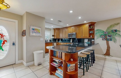 Cutthroat Harbor Estates House | Ocean-view snowbird retreat with private pool, rooftop, lanais, kayak & bikes