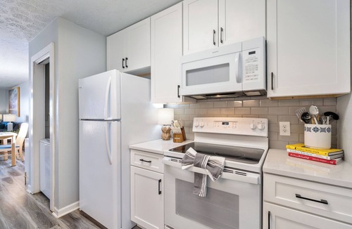 Garden City Condo | Oceanfront luxury meets easy coastal living. Enjoy miles of views, a king suite with balcony access, a 75″ TV, and an oversized fireplace all just steps from the ocean in beautiful Garden City Beach, SC. Oceanfront, with a pool and hot tub.