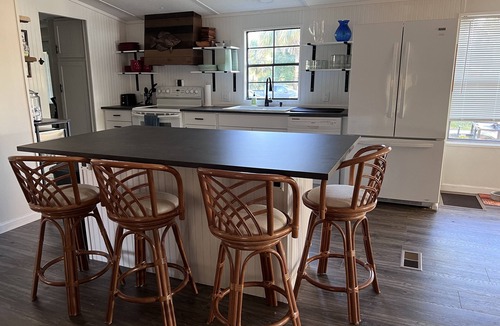 Suwannee House | Old Florida Waterfront Getaway - Large Porch, Big Dock, & Pet Friendly