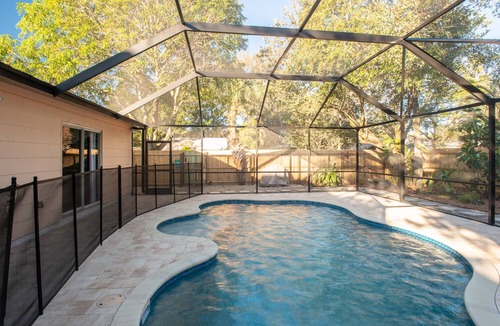 Gulfport House | Peach Hideaway - Caged, Heated Pool & Florida Room