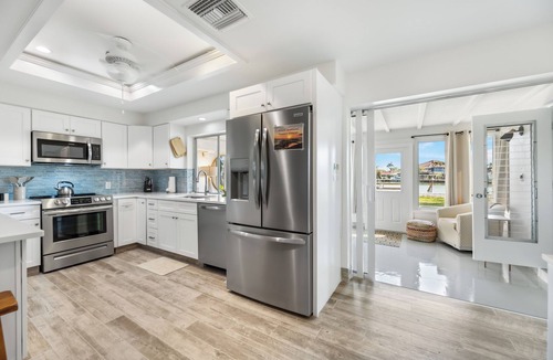 Isles of Capri House | Pet and kid friendly Key Lime Cutie with dock for 22' boat, walk to restaurants.