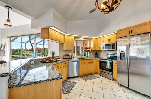 Broadmoor House | Pool + Game Room | Lanai & Canal View