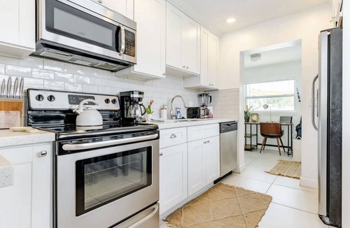 Lake Worth Cottage | Pool, Hot tub, 5 min to beach! The Monkey Cottage!