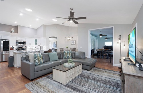 Cypress Lake House | Poolside Paradise is a luxurious modern home in the popular community of Parker Lakes