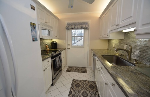 Moorings Condo | Prime Waterfront Location overlooking Moorings Bay. 7 minute walk to the beach