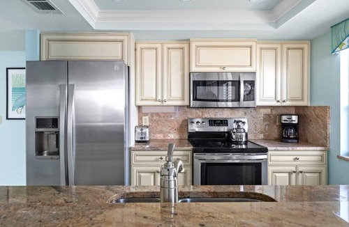 Punta Rassa Condo | Pristine Waterfront Residence with Panoramic Water Views - Pool Open!