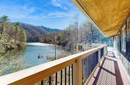 Tuckasegee House | Private eco-retreat with screened porch, play area, & wood stove