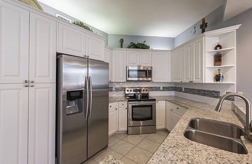 Vanderbilt Beach Condo | Private extended deck with steps down to the pool! - REG 5-205
