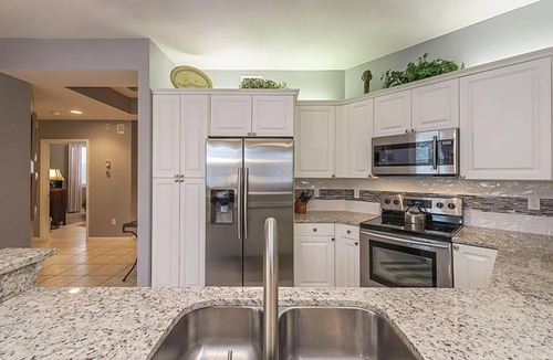 Vanderbilt Beach Condo | Private extended deck with steps down to the pool! - REG 5-205