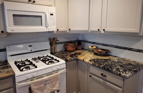 Town Bank House | Private forested log cabin steps from the Bay - pet friendly