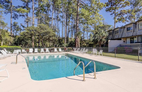 Sea Pines Condo | Professionally decorated townhome with multiple balconies, pool, & washer/dryer