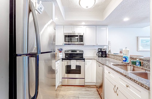 Surfcrest Village Condo | Recently updated resort condo with 2 pools, 2 balconies, ocean views, BBQ, & W/D