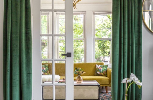 Candler Park Apartment | Relax in a king bed, work from a full executive office in this lovingly restored Iconic Little 5 Points 1920’s boutique apartment building.