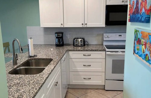 Cocoa Beach Condo | Remodeled! Granite! Sandcastles 2 BR Direct Space Coast OCEANVIEW 704!