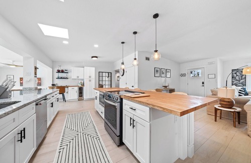 Venetian Way House | Remodeled Riverfront Pool and Dock Home in the Heart of Cocoa Beach.