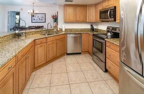 Pelican Bay Condo | Renovated Beachwalk 3 Bedroom Condo -5 minute walk to Beach!