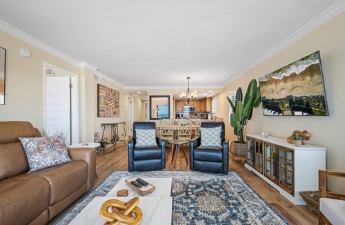 New Smyrna Beach Condo | Renovated direct oceanfront corner condo with a huge wrap-around balcony and pool