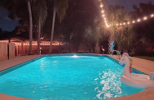 Forest City House | Resort-style home with a Heated Pool and a Huge Gated Yard