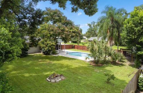 Forest City House | Resort-style home with a Heated Pool and a Huge Gated Yard