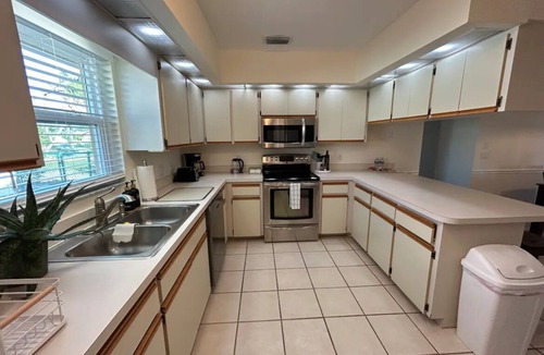 Pebble Beach House | Retreat with Screened Heated Pool Overlooking the Golf Course 3BR/2BA