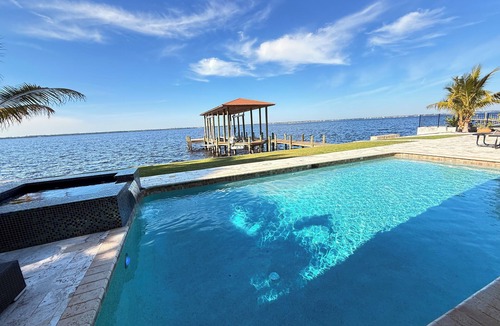 Riverside Park Villa | Riverfront 5 bedrooms, 5 baths , pool , spa , beach , dock and stunning views !