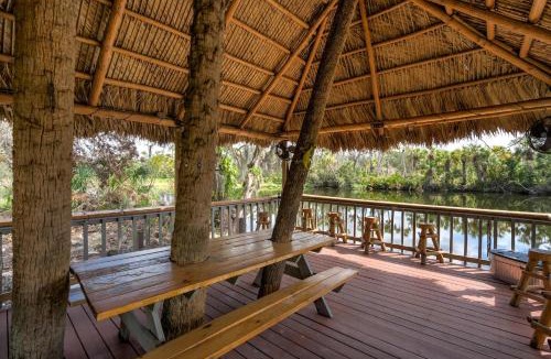 Braden River Apartment | Riverside Breeze Tropical Retreat w Tiki Hut&BBQ