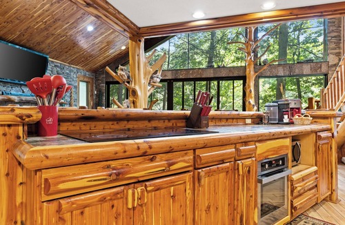 Ellijay Cabin | Riverside Luxury: Hot Tub, Fire Pit & Fishing Dock! Game Room, Fireplace!
