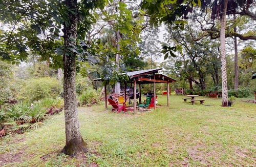 Bronson Cabin | Rustic riverfront cabin with views, firepit, grill, canoe, kitchen, & W/D