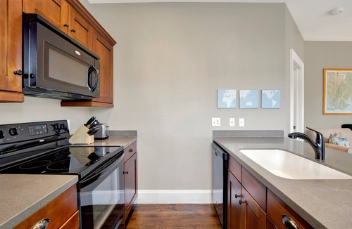 Historic Downtown Savannah Apartment | Saltwater Pool, Outdoor Fireplace & Garage!