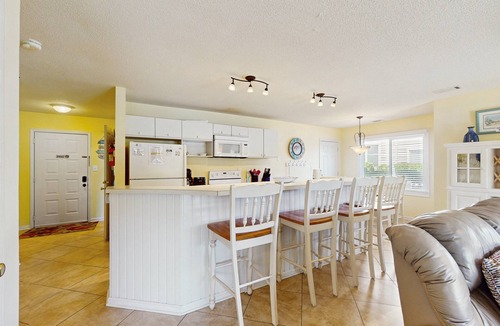 Sea Trail Condo | SB64: Lakefront condo with patio, AC, & water views plus pool & tennis