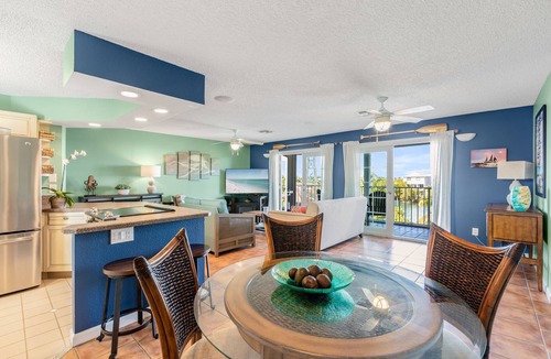 New Town Condo | SEA-NIC VIEW ~ 2 BR/2Ba Water-front views, Heated Pool Access and Dockage!