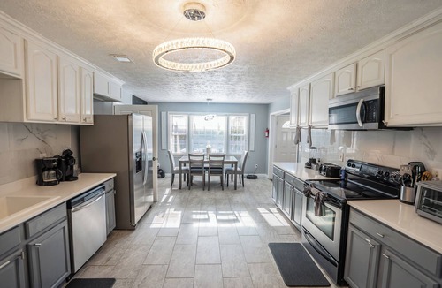 Riverdale House | Spacious 6-bedroom house with Fire Pit, and Game room in enchanting Riverdale