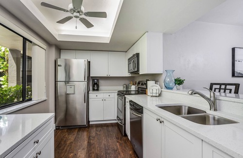 Bonita Bay Condo | Spacious, air-conditioned condo with private W/D, beach shuttle, & central AC