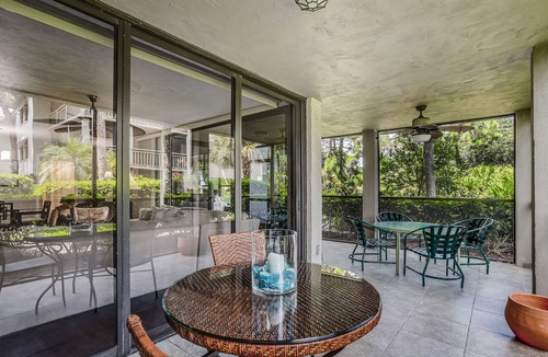 Bonita Bay Condo | Spacious, air-conditioned condo with private W/D, beach shuttle, & central AC