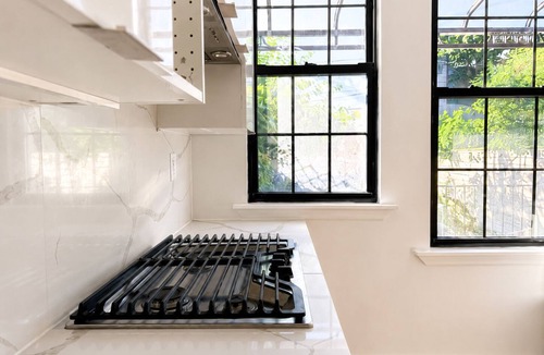 Cypress Hills House | Spacious Brooklyn Townhouse Theater Backyard Sleeps 16+