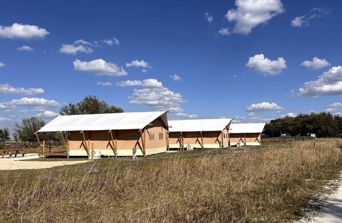 Okeechobee RV Rental | Spacious Deluxe Safari Tent with Fire Pit & BBQ Grill in Basinger, Florida