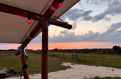 Okeechobee RV Rental | Spacious Deluxe Safari Tent with Fire Pit & BBQ Grill in Basinger, Florida