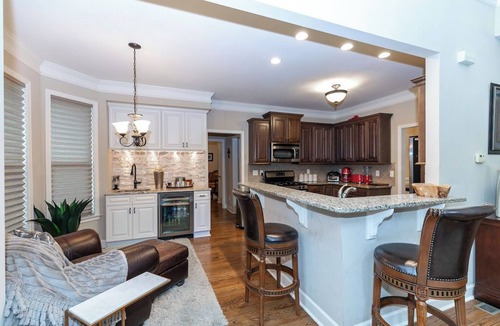 Mableton House | Spacious home with cozy bedrooms, basement lounge, screened porch, and full kitchen. Minutes from Mercedes-Benz Stadium, Six Flags, and downtown. Comfort, space, and a prime location—book now!