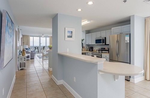Pensacola Beach Condo | Spacious, open layout floor to ceiling with a wrap around balcony - ED1250