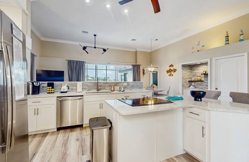 Burnt Store Isles House | Spacious, waterfront home with dock, heated pool, and lanai