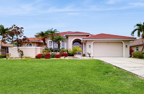 Burnt Store Isles House | Spacious, waterfront home with dock, heated pool, and lanai